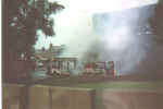 CLICK TO ENLARGE.  View from over my garden gate.  A Citybus burns at the Limestone Road interface.